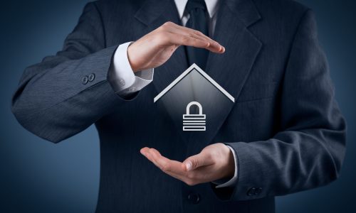 Property security Property security and insurance concept. Protecting gesture of man and symbol of house with padlock.